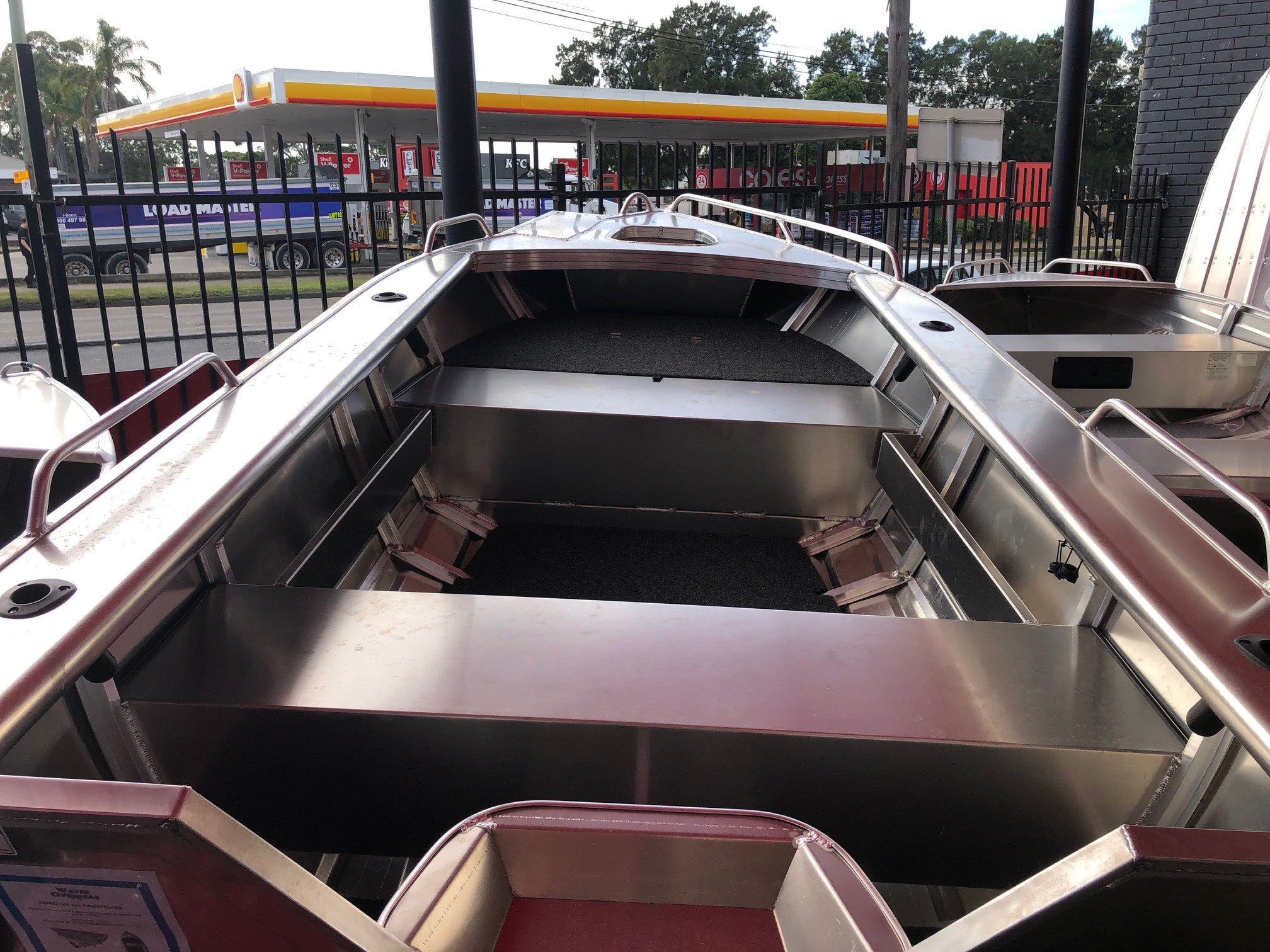 a silver and black boat in a body of water