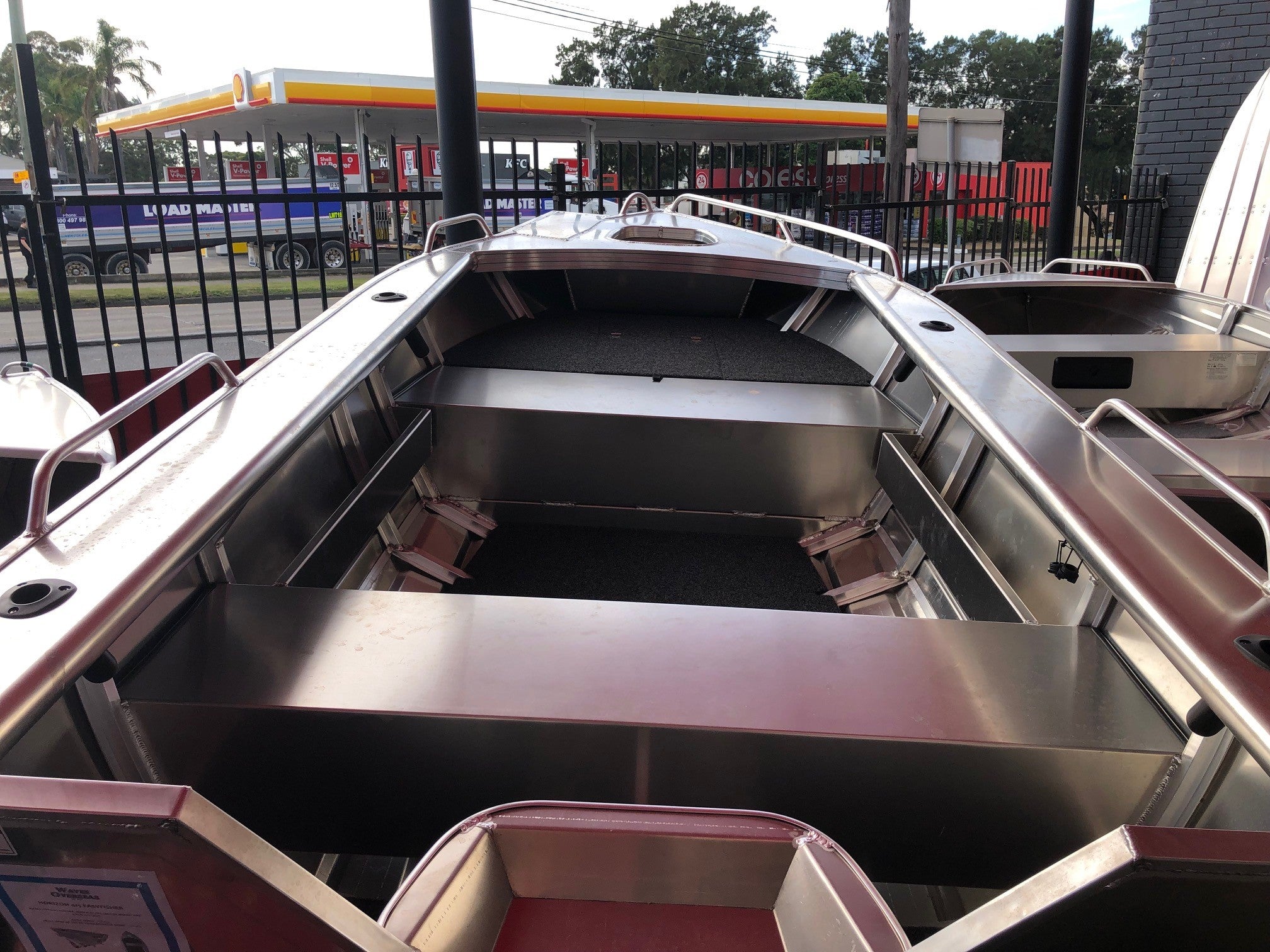 a silver and black boat in a body of water 