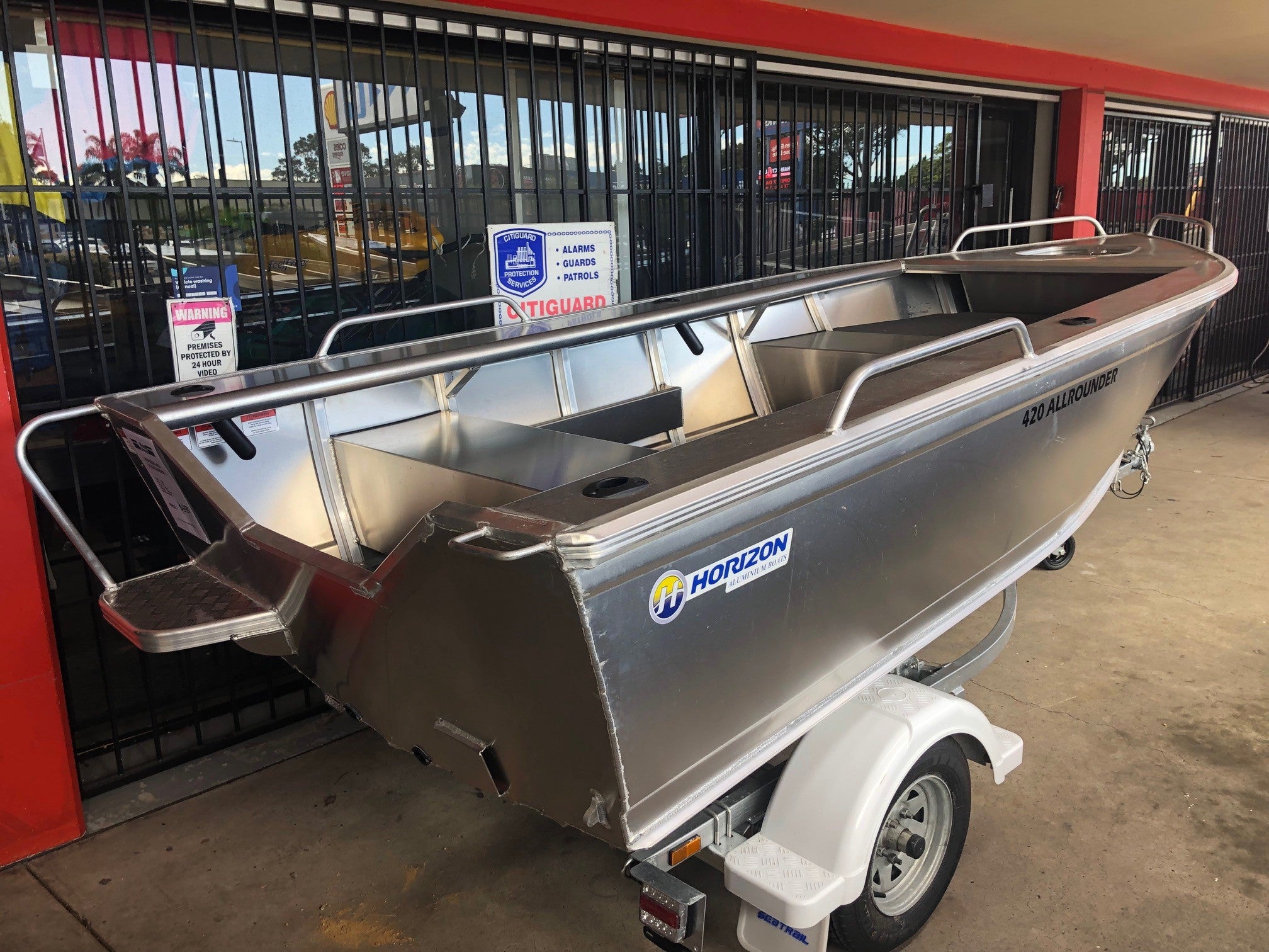 a row of parked cars parked in a parking lot